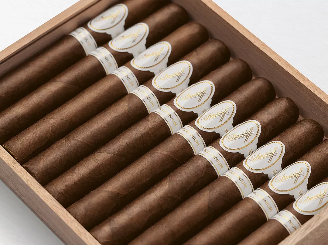 Opened wooden box of Davidoff Millennium cigars.